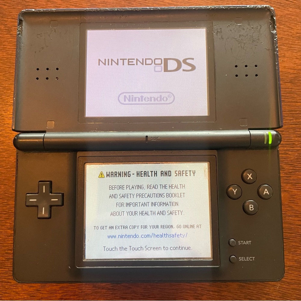 Nintendo DS Lite Handheld Console in Cobalt & Black
Please see photos for marks